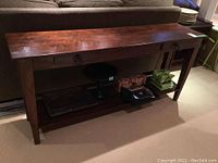 Front view of full table showing two drawers and lower shelf