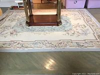 Full view of rug under table showing overall size and design