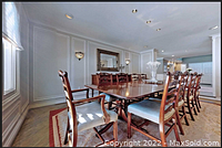 Full room view showing table with all chairs and leaves installed