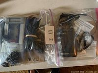 Both the Sanyo radio cassette player with cords and the Sony Walkman with headphones in separate sealed bags.