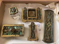 All five pieces arranged in box: inkwell, picture frame, stamp box, letter opener, pen rest