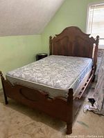 Full view showing headboard, footboard, mattress on slats