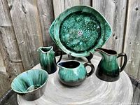 Five-piece vintage BMP ceramic set including tray, two jugs, one bowl, and one creamer jug in green drip glaze finish.
