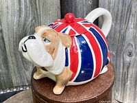 Bulldog teapot side view showing the bulldog's face and Union Jack flag pattern on the body.