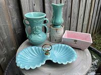 Front view showing all four pieces arranged on wooden surfaces, highlighting colors and overall size.