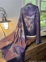 Wrap draped on mannequin showing purple and gray heather floral pattern and fabric texture