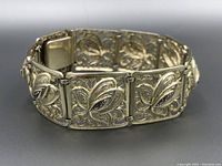 Full view of the Birks sterling silver filigree floral bracelet showing multiple linked rectangular panels featuring ornate floral filigree design