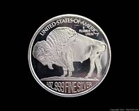Clear front view of the Buffalo and inscriptions on the silver coin.