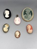 All six cameo items arranged in two rows for visual inventory