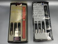 Coral red Sheaffer Nonsonsense Calligraphy pen set including pen, three nibs, and seven ink cartridges in packaging.