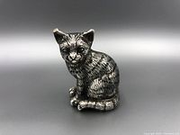 Front view of the sterling silver cat figurine showing detailed fur texture and facial features.