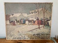Full view of the winter scene print showing the buildings, horses, and sleighs covered in snow, set on board with natural aging on edges.