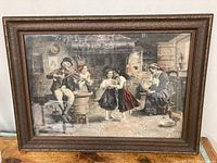 Full view of framed antique print showing family kitchen scene with violin player and dancing children