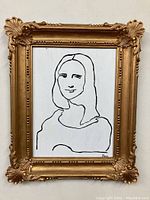 Full view of the original Mona Lisa silhouette painting in an ornate gold resin frame.