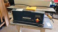 Front view showing Mastercraft branding on blue housing and tabletop surfaces