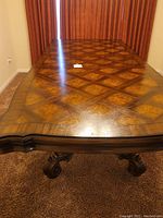 Top view of dining table illustrating parquet veneer pattern and extension leaf section
