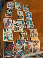 Spread of baseball cards showing various players including Steve Garvey, Woodie Fryman, and others in colorful 1970s-1980s style cards.