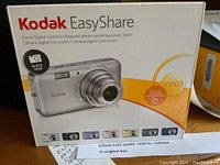 Kodak EasyShare V1003 Zoom Digital Camera in original box showing front and product specifications