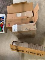 Three stacked boxes of tile; top box of Daltile glazed floor tile 12x22 visible; bottom box labeled Dal-Leader glazed wall tile 4x4