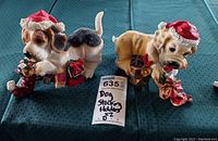 Front view of both dog stocking hangers showing details and colors