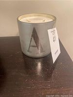 Photo showing front frosted glass candle container with letter 'A' and auction lot number tag