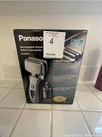 Panasonic ES8249S rechargeable men's electric shaver in original box showing features and specifications.