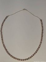 Full length view of the Byzantine chainmaille necklace showing the two-tone design and lobster clasp.