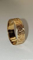 Oblique view of ring showing carved eagle motif