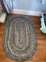 Oval braided Bay Colony Collection Beacon Hill rug shown on hardwood floor, displaying full rug with subtle multi-color pattern.