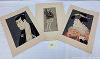 Three color woodblock prints showing male and female Japanese actors in traditional dress, two portrait style and one full-figure.