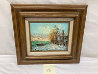 Framed landscape and seascape oil painting on canvas showing the overall artwork and frame.
