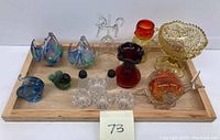 Full lot view showing all vintage art glass items on wooden tray.