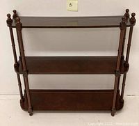 Front view of the 3-tier mahogany shelf showing design and dimensions