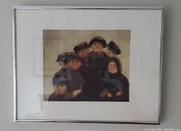 Framed art print showing a group portrait of seven people in dark hats and clothing.