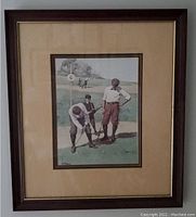 Full view of framed print showing art, matting, and wood frame.