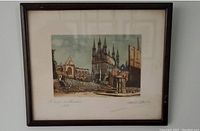 Framed colored etching showing architectural ruins under cloudy sky with dark wood frame and off-white matting.