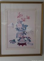 Full view of framed pastel floral print showing flower pot and flowers.