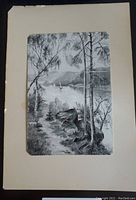 Full view of the black and white river landscape image showing trees, rocks, sailboats, and distant mountains.