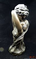 Front side of bust sculpture The Lovers showing intertwined couple in close embrace