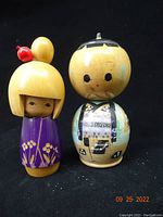 Front view of both dolls showing size and details.