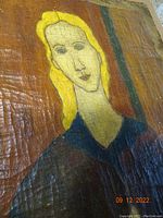 Close-up of head and upper torso showing elongated facial features and heavy surface cracks