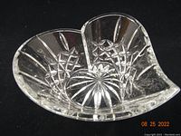 Front top view showing heart-shaped opening and intricate cut crystal patterns with star and diamond shapes.