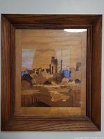 Full image of the framed wood inlay art showing the detailed castle and landscape scene.