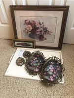 Photo of the full set including large framed floral art, two small and two medium metal framed floral artworks, and wooden serving tray