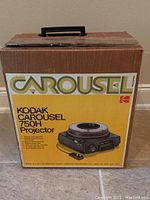Original cardboard box for Kodak Carousel 750H projector with handle and product label.