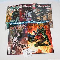 Front view of six Batman comics including Detective Comics and annual issue, showing cover art and condition.