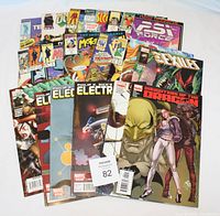 Overview photo of the full comic collection showing multiple issues with visible titles and artwork.