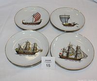 Close-up of four plates showing detail of historical ships including William the Conqueror 1066 Viking ship and Cooks Endeavor bark 1768.