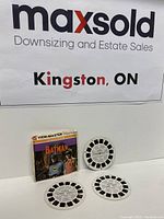 Original Batman TV Series 3 reel packet with three reels below it on white background and MaxSold poster in background