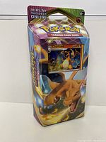 Photo of vertical Charizard box pack with cartoon Charizard artwork and visible Charizard card, front view